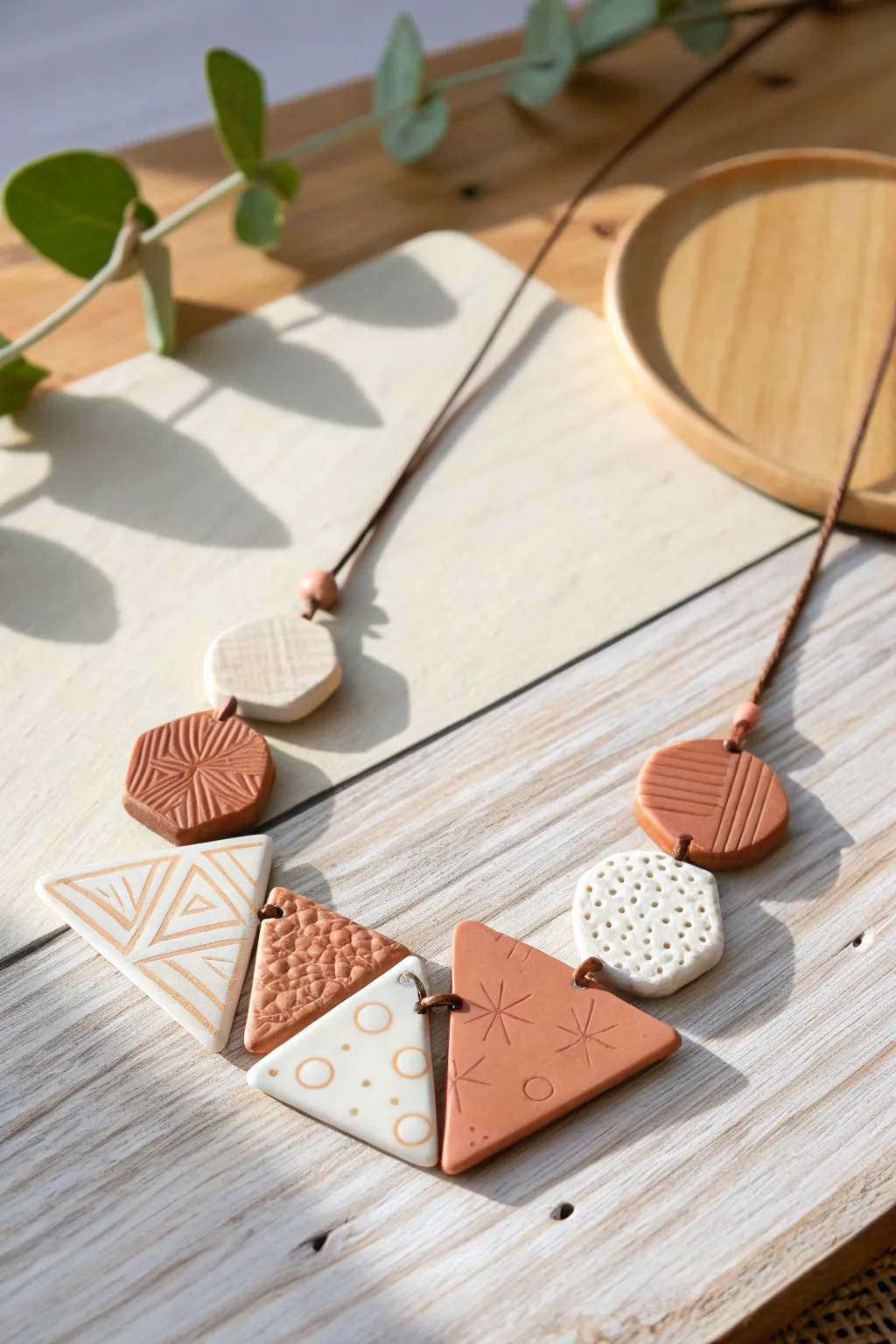 Embrace modern elegance with handcrafted geometric clay necklaces—where simplicity meets artistic flair.