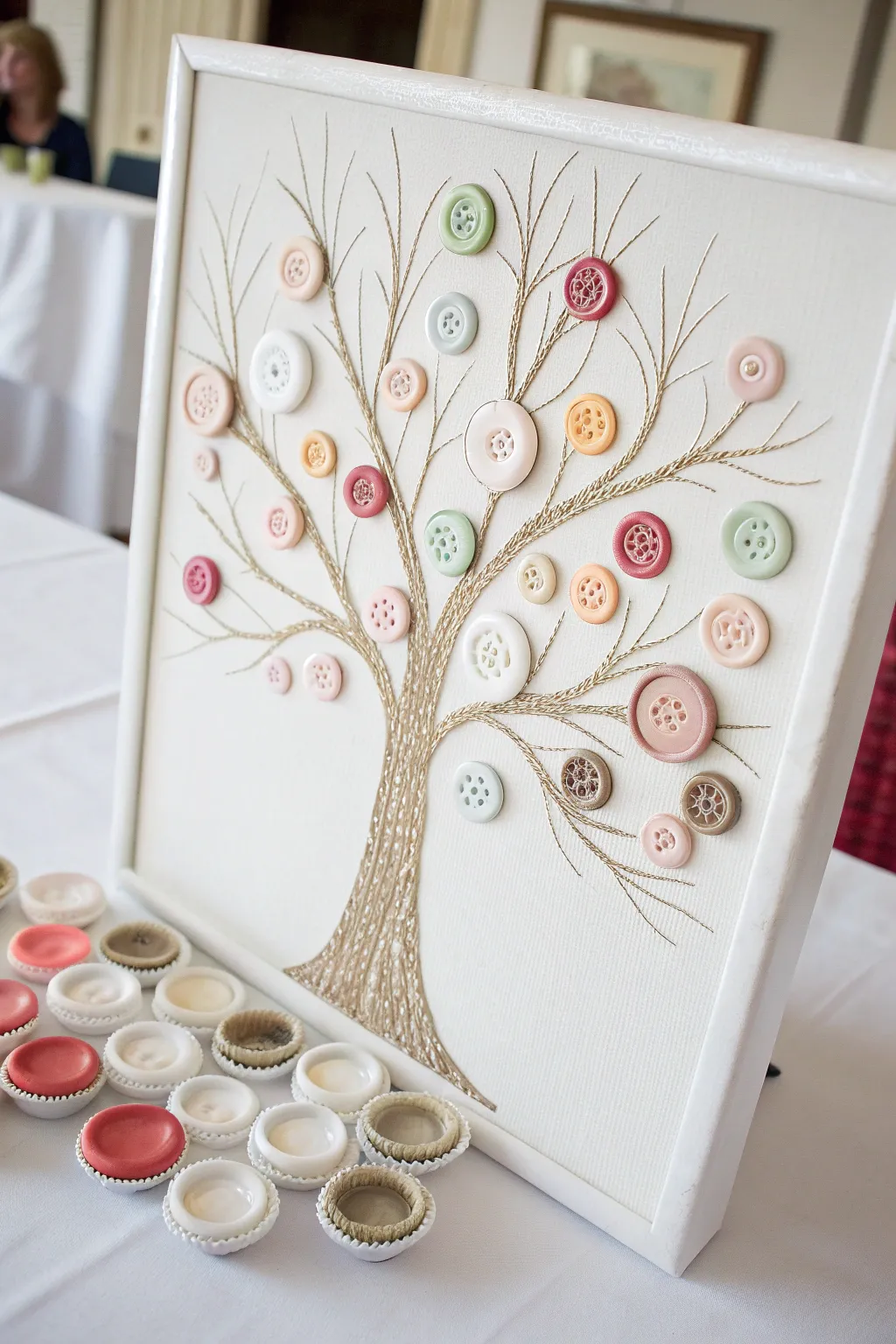 Create a unique family tree with bottle caps and buttons—a perfect blend of minimalist style and personal touch for your next family reunion.