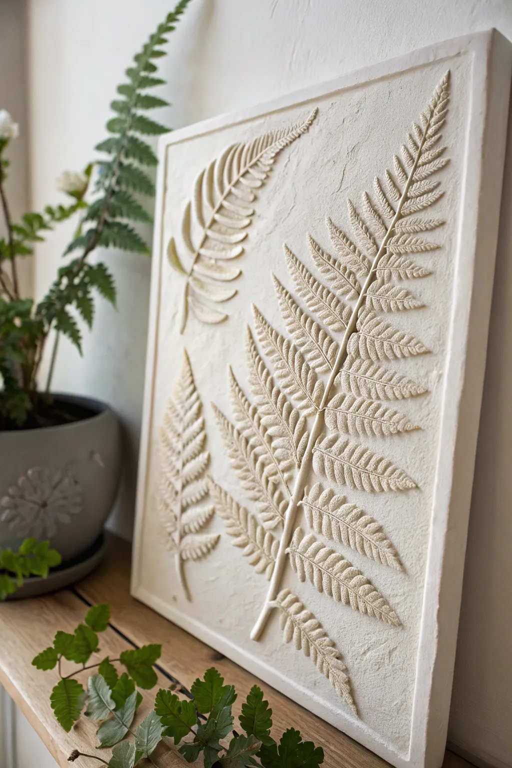 Capture nature's elegance with delicate fern imprints on clay—perfect for adding a touch of minimalist beauty to your wall.