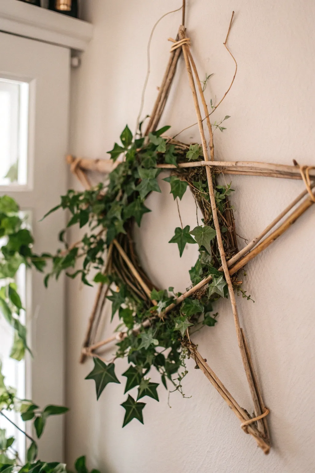 Bring a breath of fresh air into your home with this charming foliage-filled star wreath, perfect for adding a touch of nature and elegance to any space.