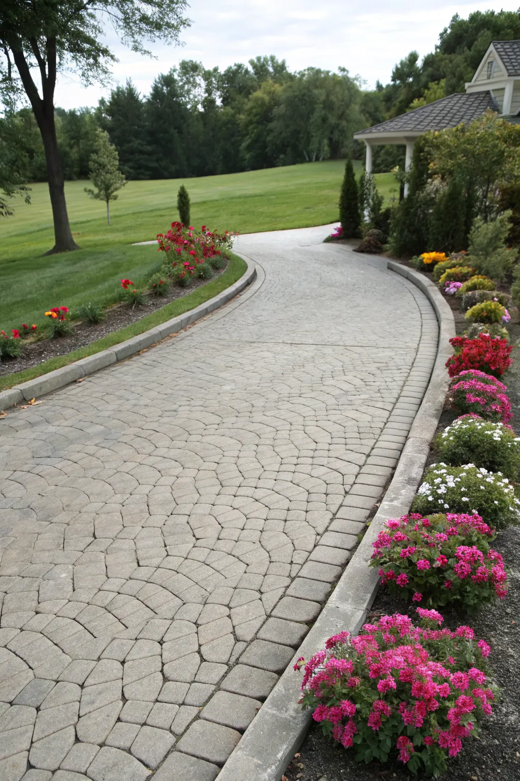 Stamped concrete driveway with cobblestone appearance.