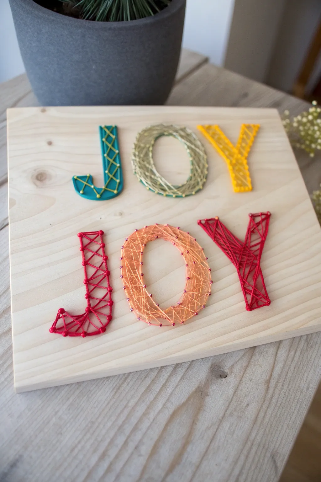 Bring a touch of joy to your space with this vibrant and minimalist string art masterpiece.