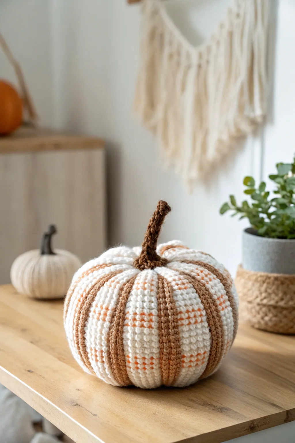 Add a charming twist to your fall decor with a plaid-patterned crochet pumpkin. 🍂✨ #FallDecor #CrochetLove