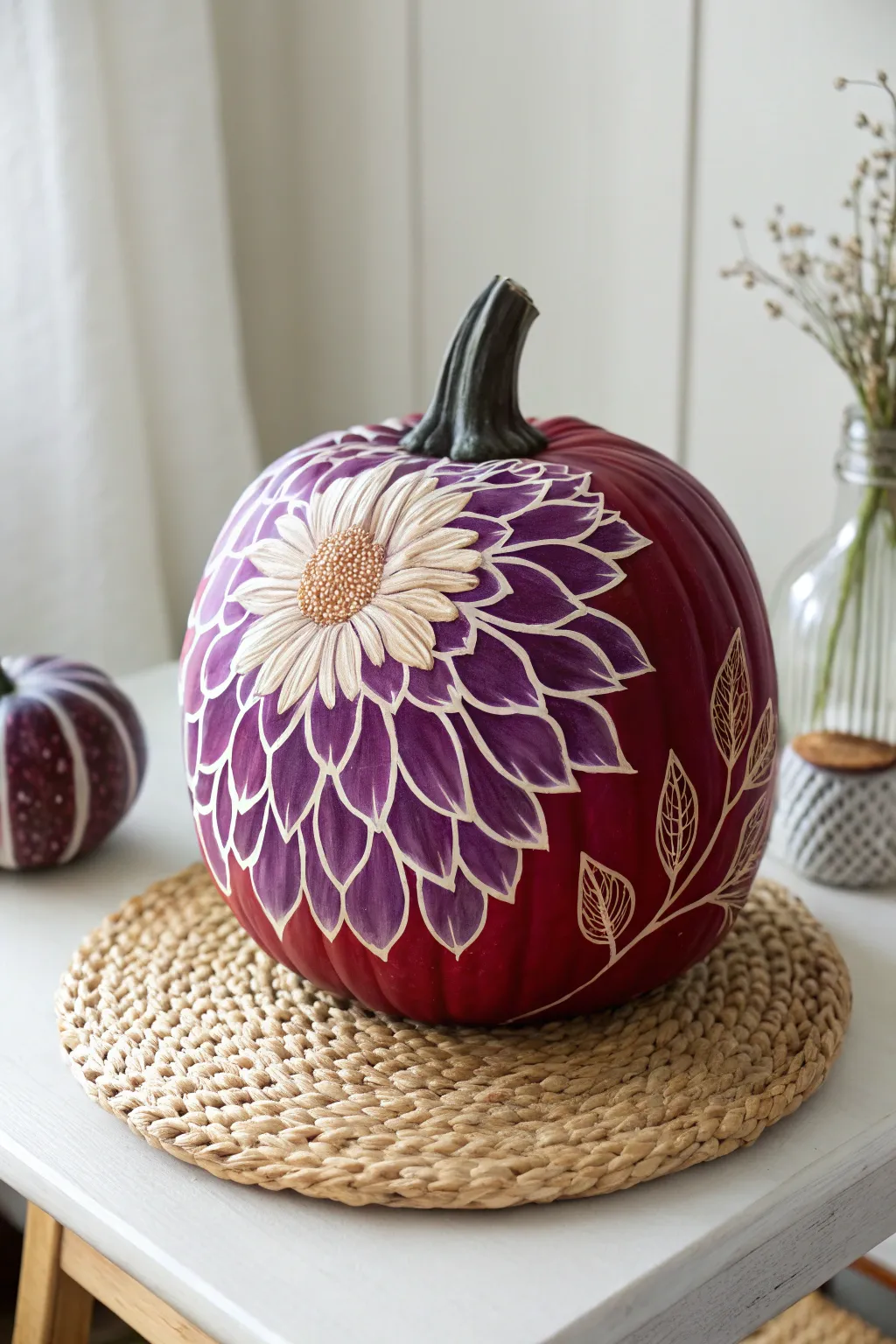 Embrace autumn elegance with a chrysanthemum-painted pumpkin, where artistry meets nature's charm.