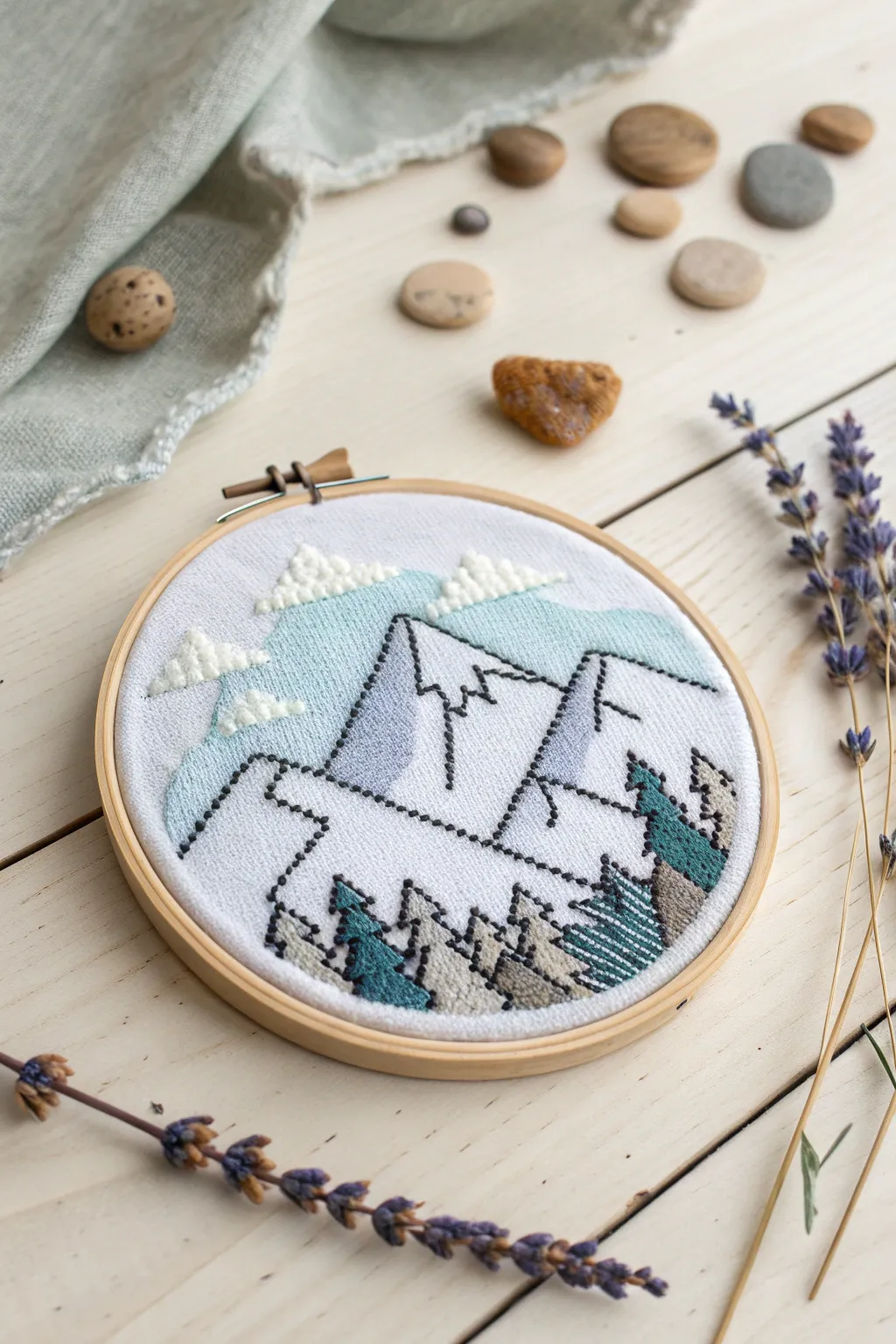 Bring the serenity of majestic mountains into your home with this charming cross stitch pattern. Perfect for beginners!