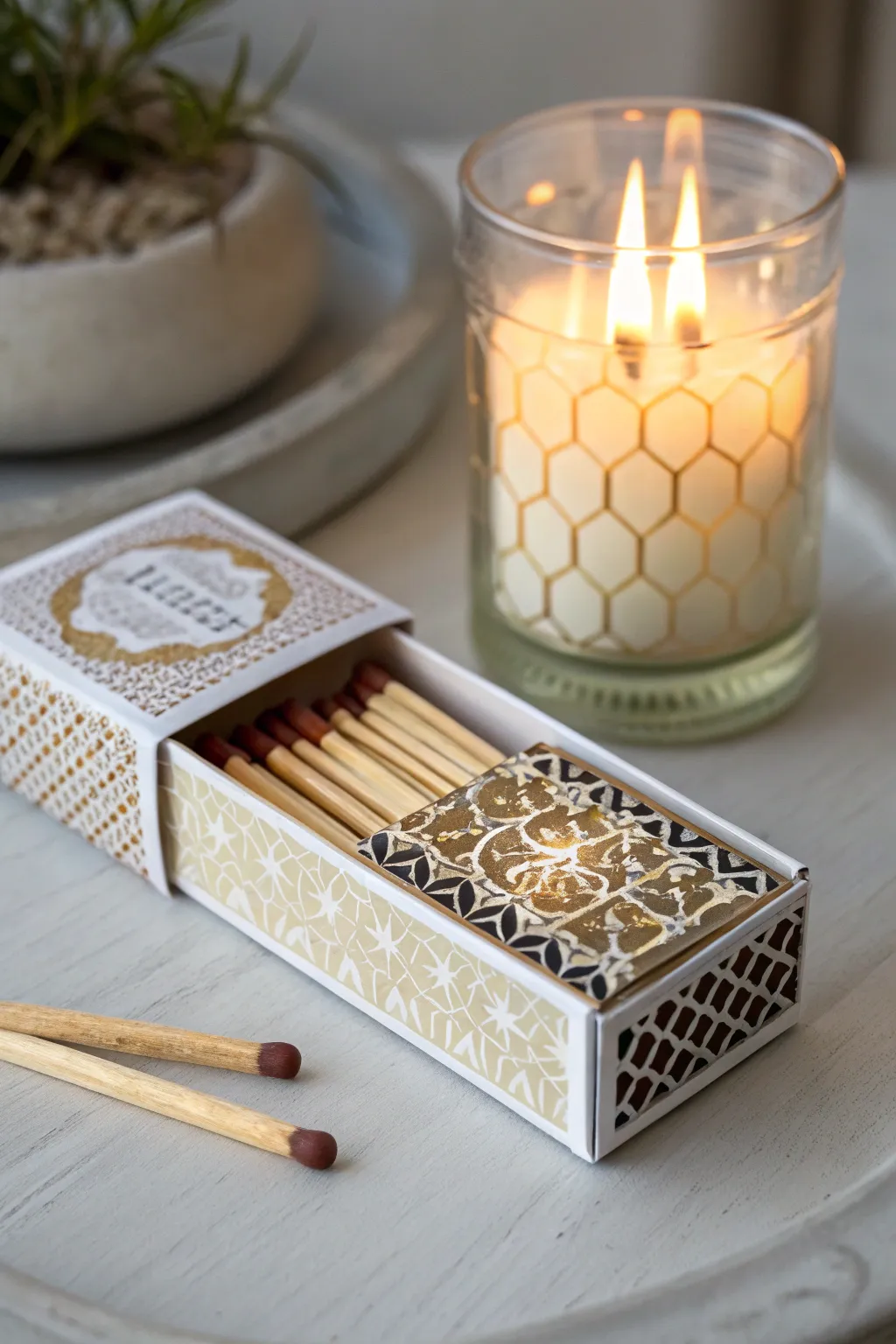 A decorative matchbox adds flair and function to your candle gift.