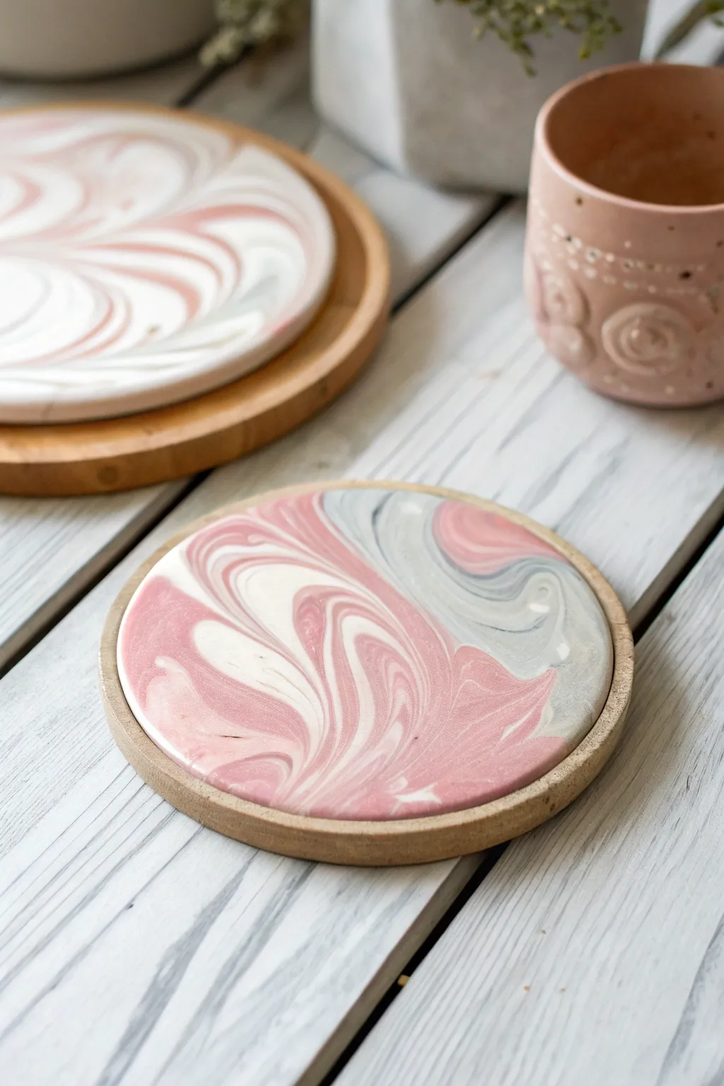 Elevate your tabletop with the enchanting beauty of marbled clay swirls. Each coaster is a unique masterpiece.