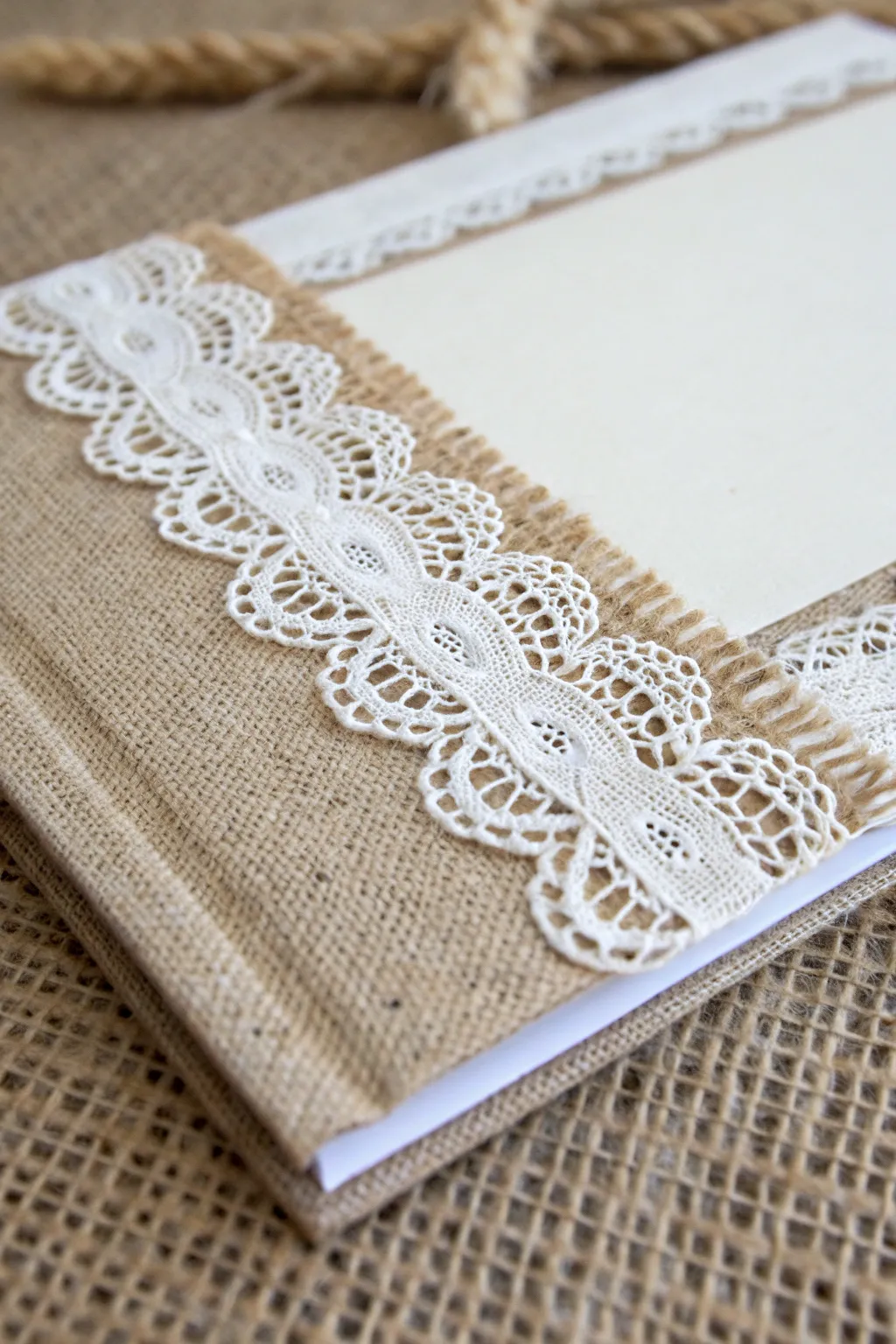 Elevate your scrapbook with the timeless elegance of lace and burlap textures.