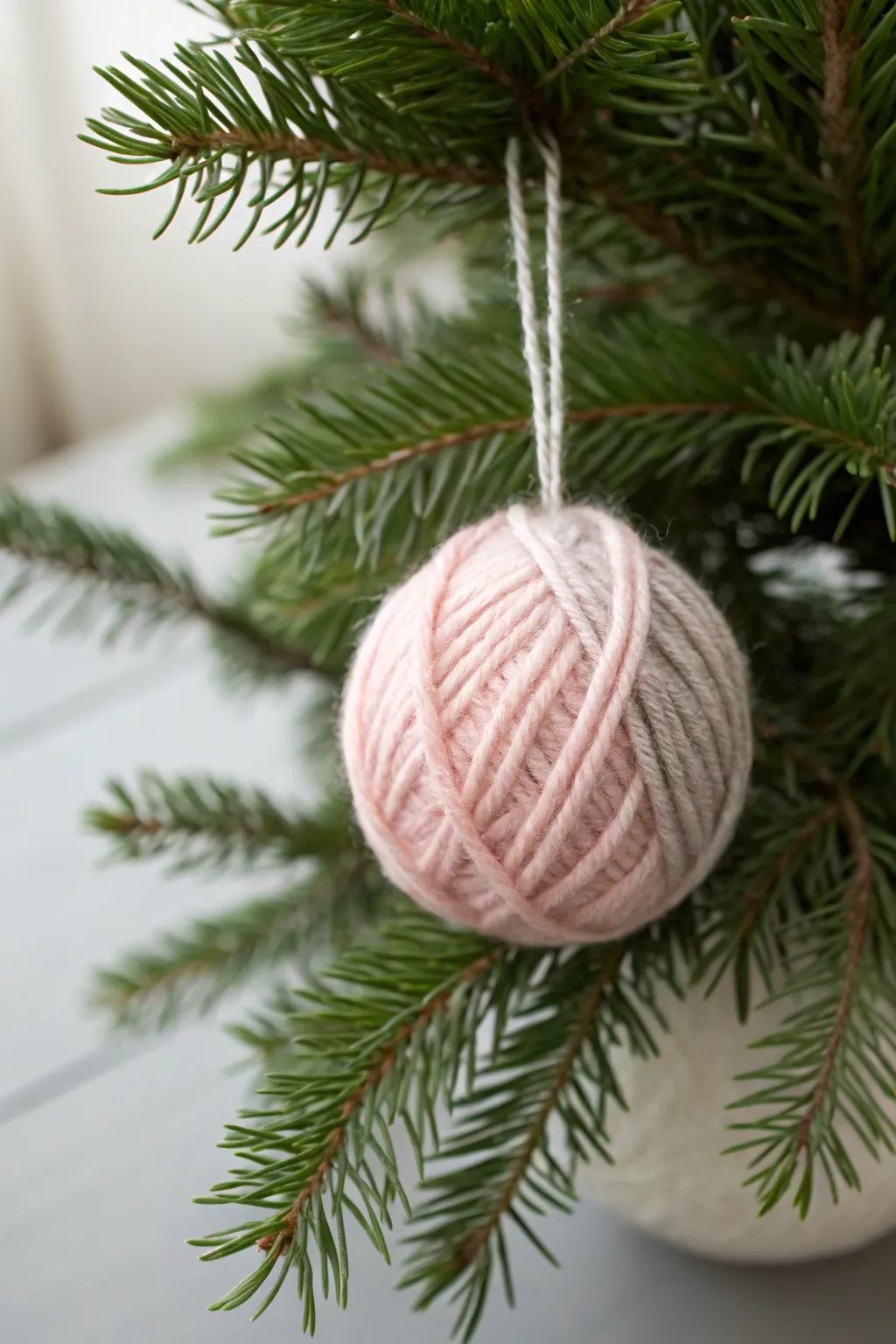 Cozy up your Christmas with handmade yarn ornaments that bring warmth and charm to your tree.