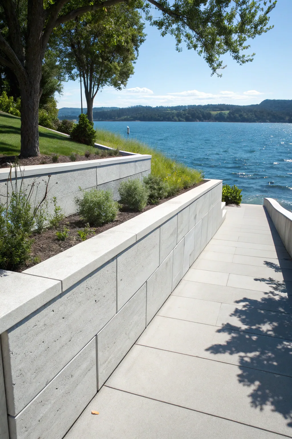 Embrace modern elegance with a sleek concrete retaining wall—where style meets strength by the lake.