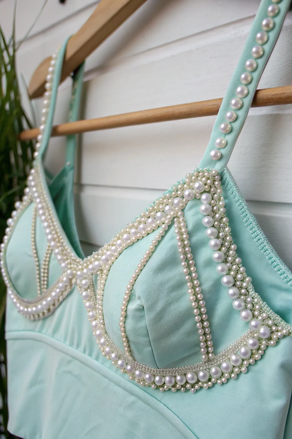 Embrace the ocean's elegance with a pearl-adorned mermaid top that shimmers with every movement.