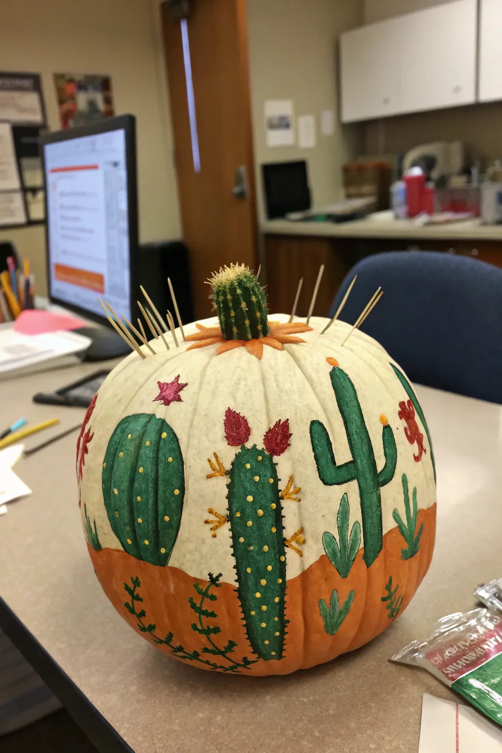 A whimsical cactus garden on a pumpkin, adding a touch of the desert to your workspace.