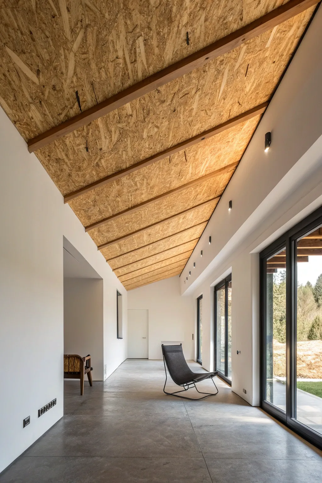 Elevate simplicity with an OSB ceiling, the perfect touch for a modern minimalist space.