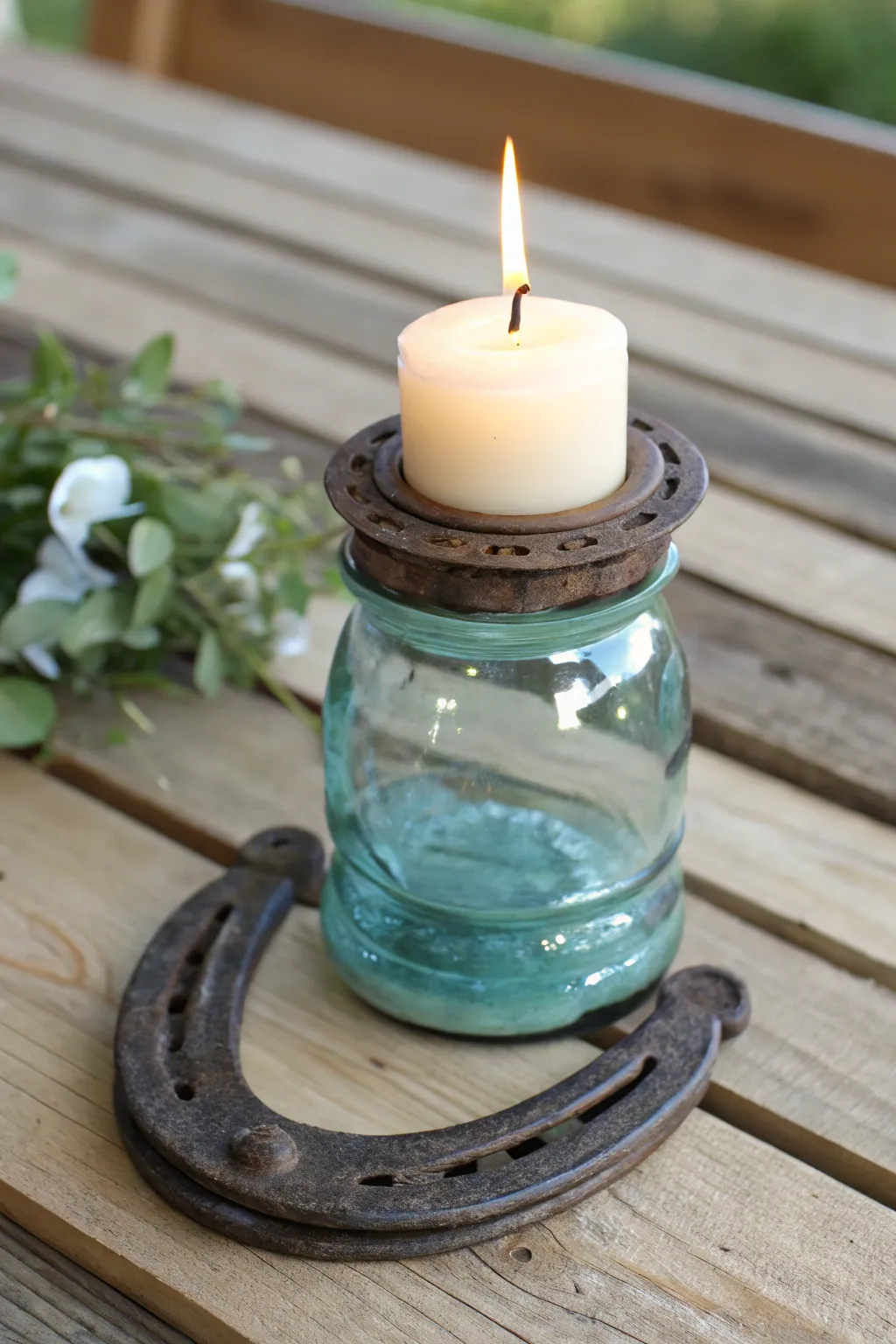 Transform vintage glass insulators into charming rustic candle holders for a cozy, boho-inspired dining experience.