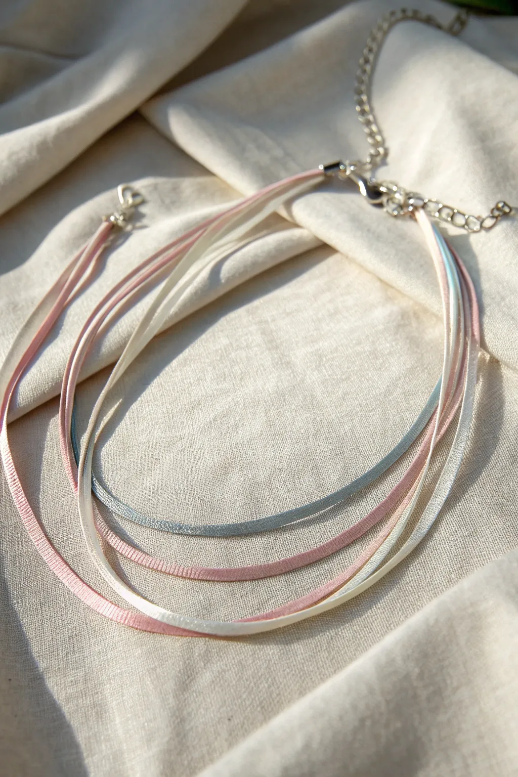 Elevate your style with the effortless elegance of a layered ribbon choker.