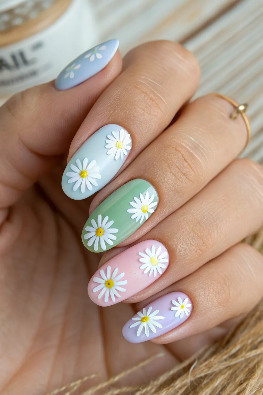 Embrace a pastel rainbow on your fingertips with charming daisy accents.