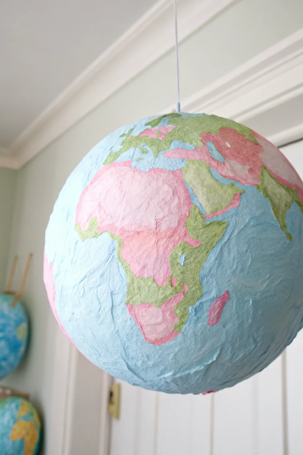 Craft your own universe with this enchanting paper mache planet—a perfect blend of creativity and simplicity.