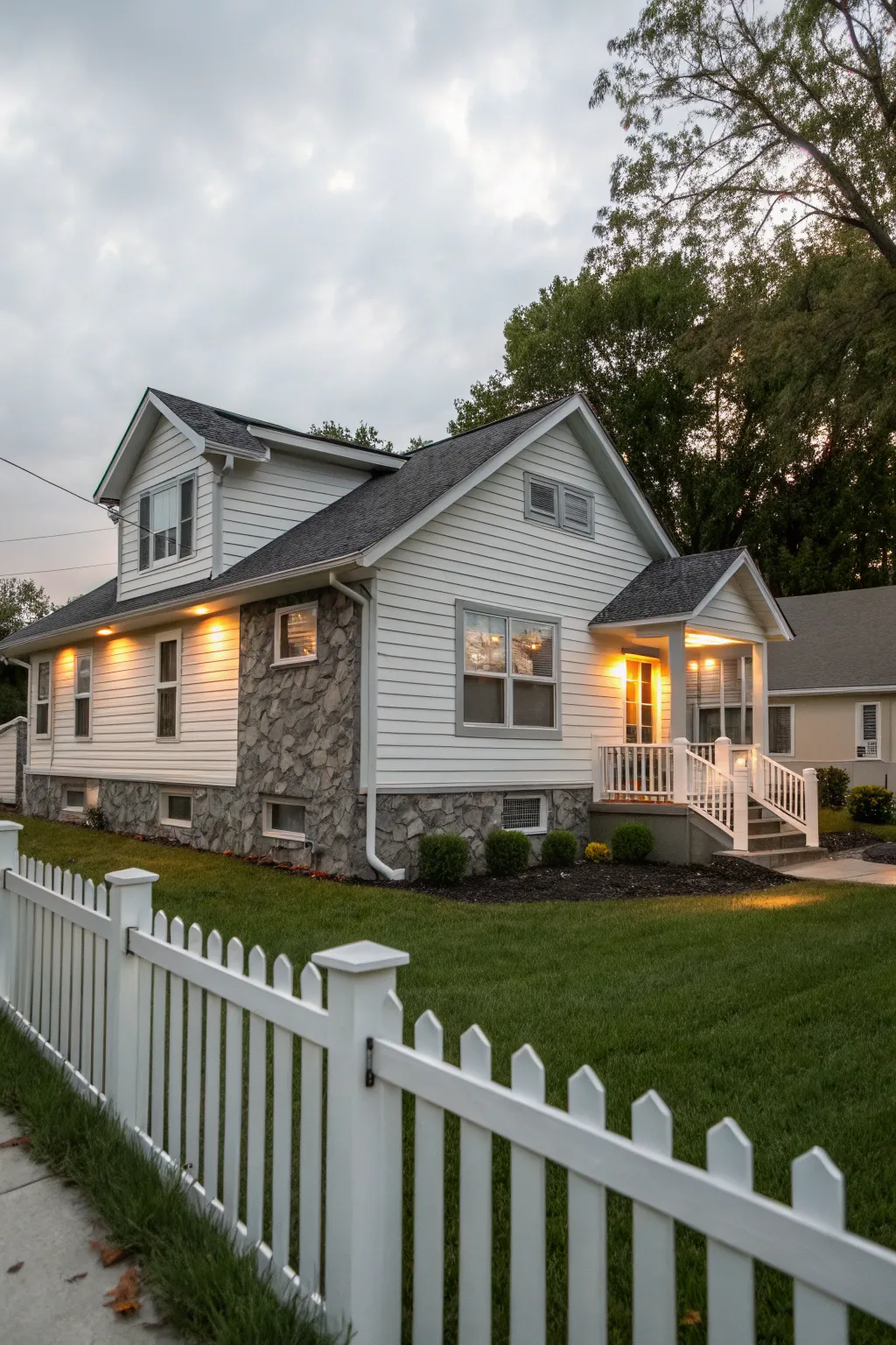 Vinyl siding paired with stone creates a textured exterior.