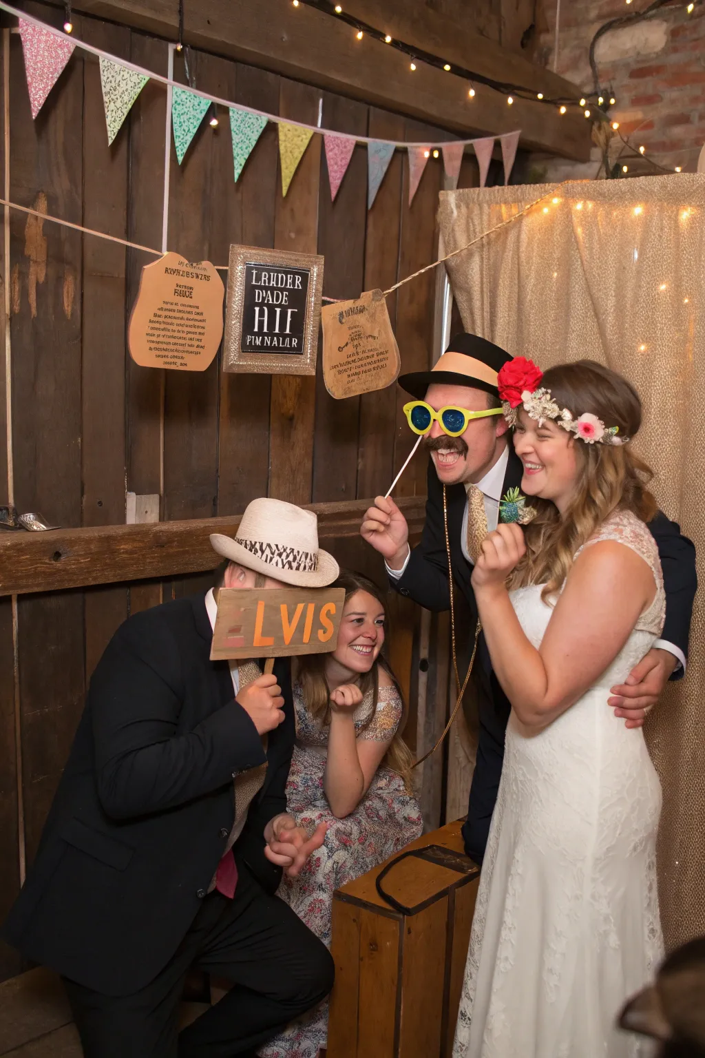 Guests enjoy playful moments at the vintage photo booth.