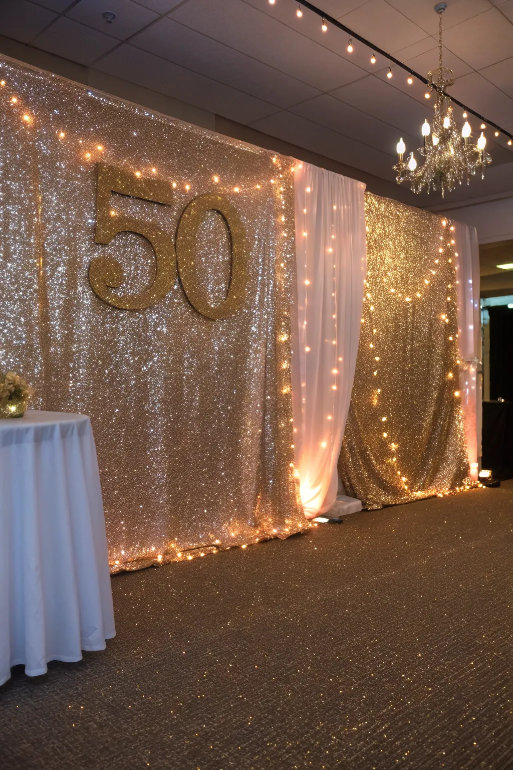 A sparkling glitter backdrop that adds a touch of elegance to a 50th anniversary celebration.