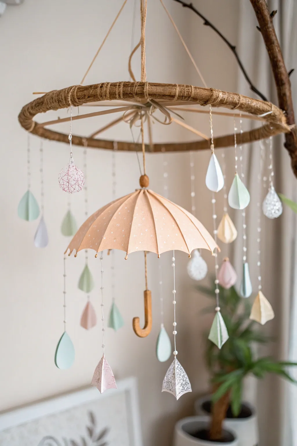 Add a touch of whimsy to your baby shower with this charming umbrella mobile. 🌧️✨ #ScandinavianStyle #BohoChic