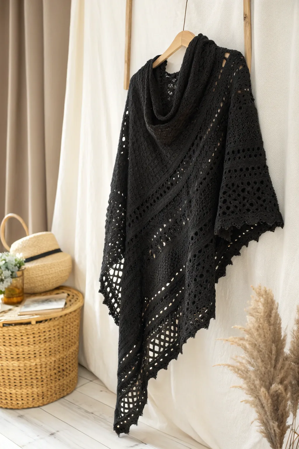 Embrace the art of warmth with a handcrafted black crochet shawl, where simplicity meets elegance.