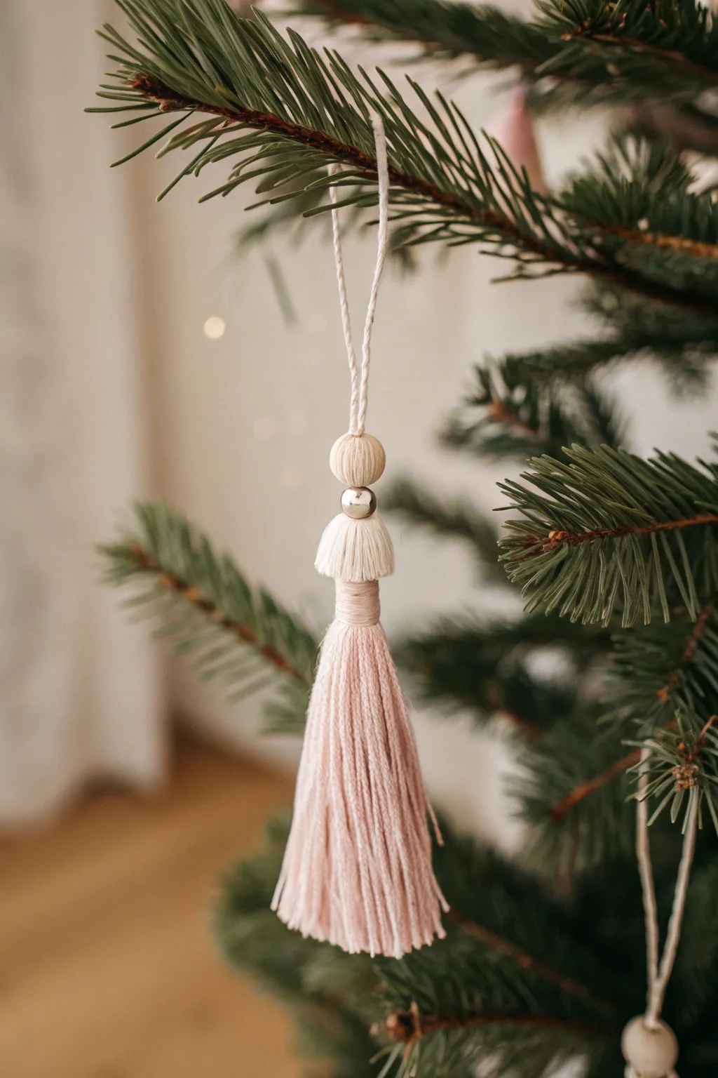 Add a touch of handmade whimsy to your holiday decor with elegant fabric tassel ornaments.