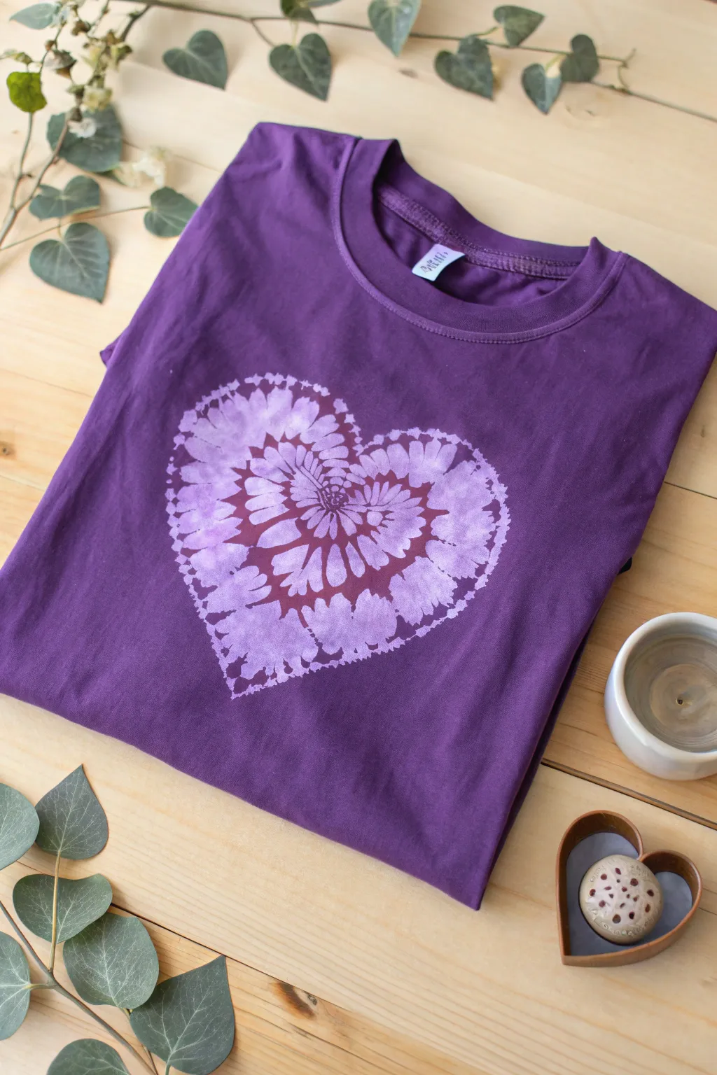 Embrace nostalgia with a heart-shaped tie-dye on your purple tee! A perfect blend of retro charm and boho simplicity. 🌿💜