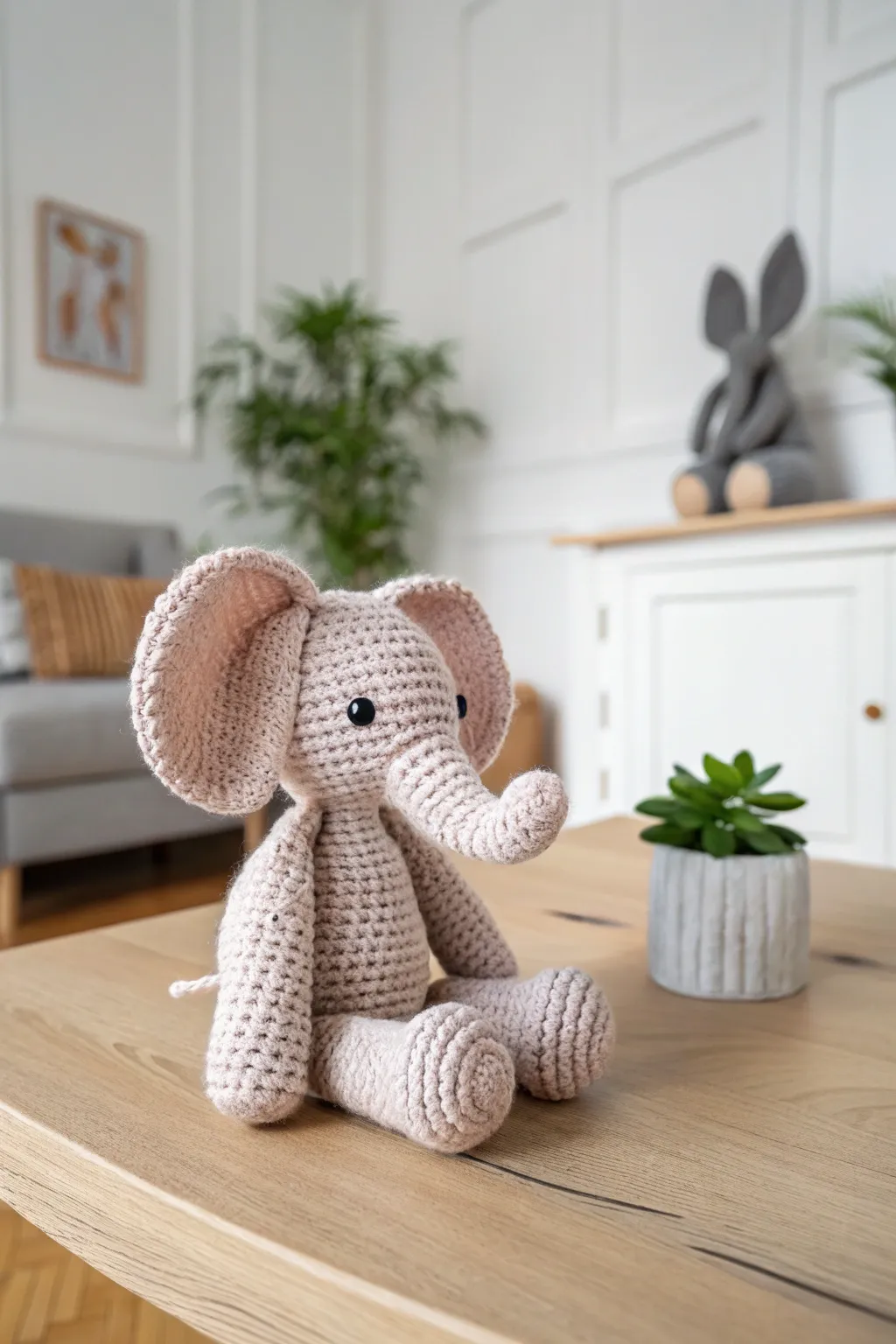 This adorable crochet elephant with oversized ears brings a touch of whimsy and warmth to any minimalist space.