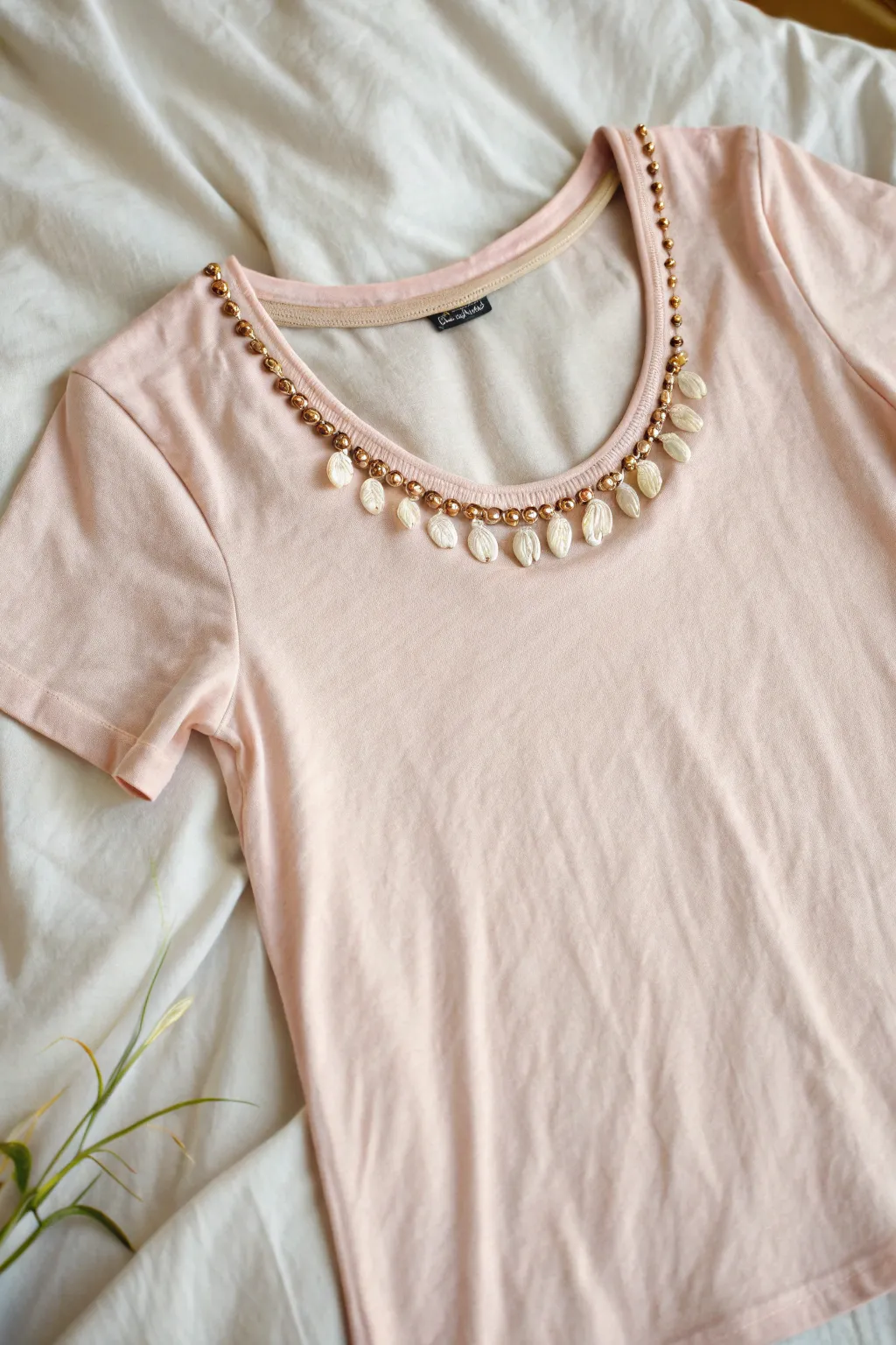 Elevate your style with a DIY scoop neck tee and a stunning statement necklace. Simple, chic, and perfectly you.