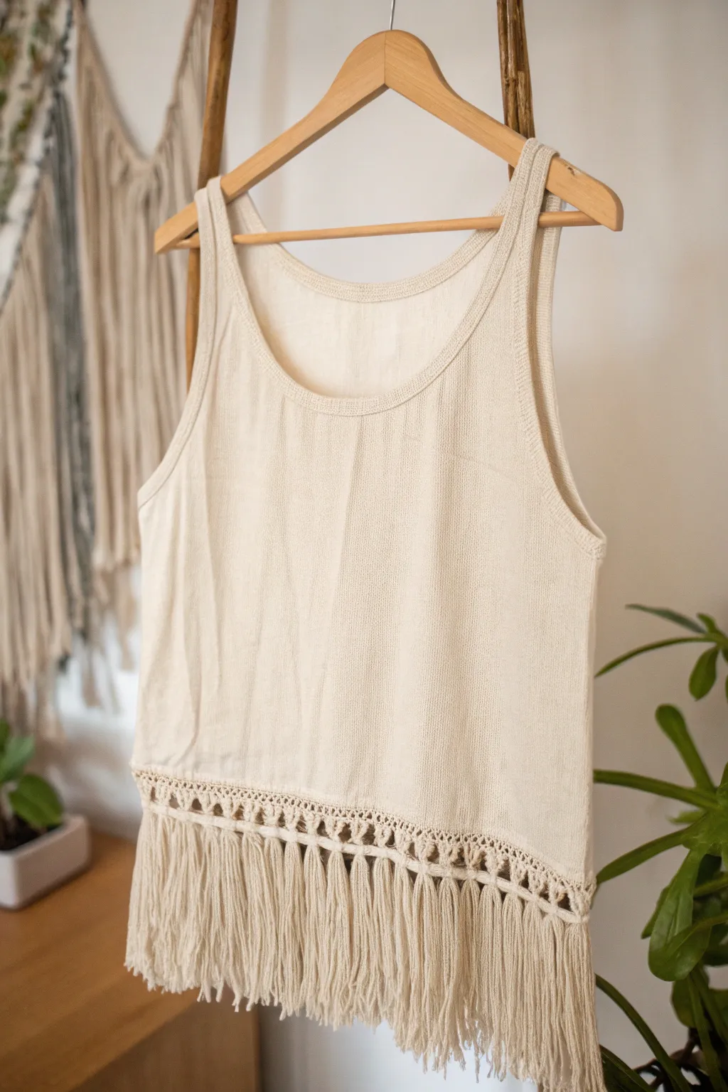 Embrace boho elegance with a fringed hem tank top—perfect for breezy beach days!