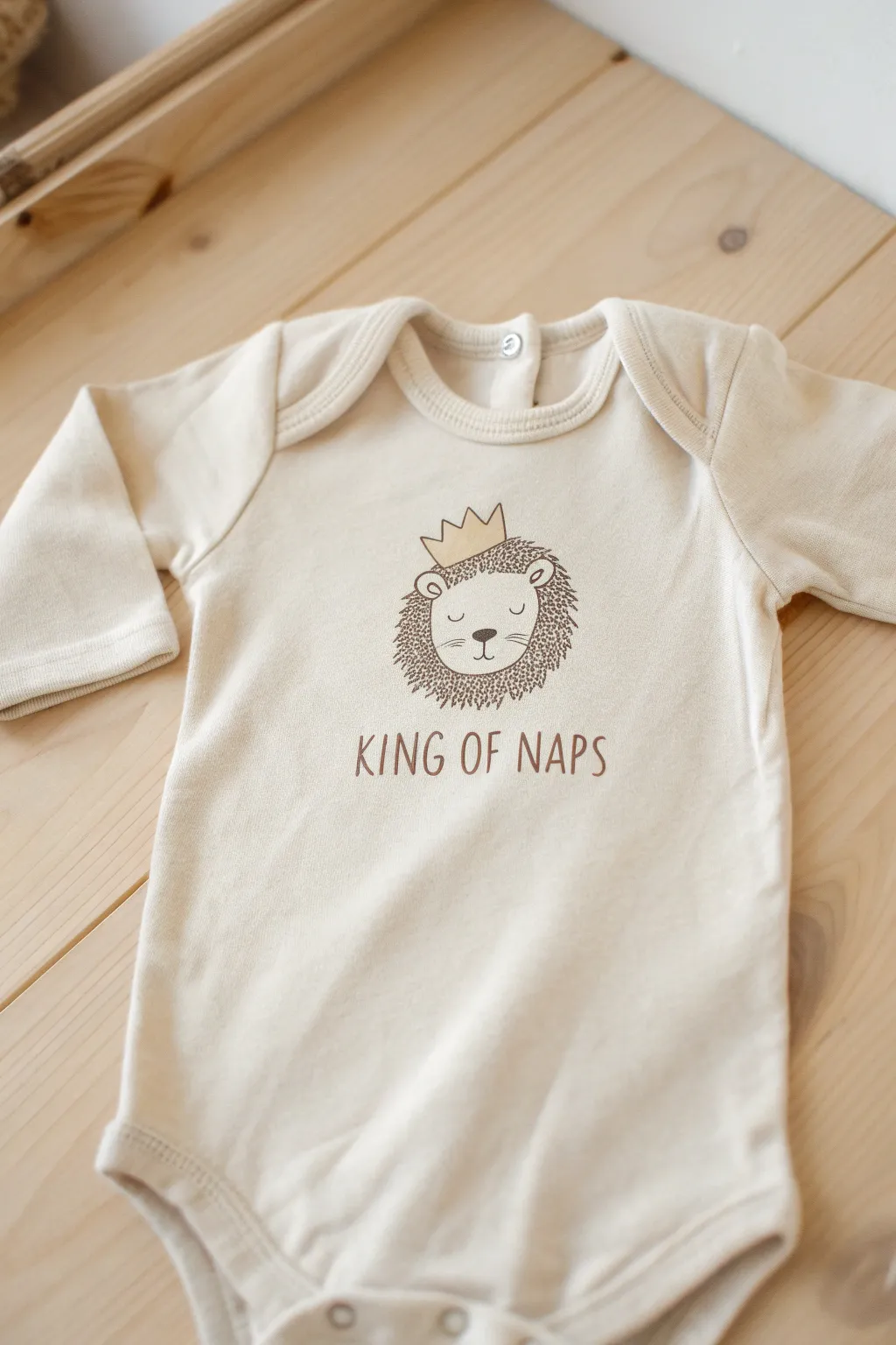 Embrace the wild side of nap time with this adorable 'King of Naps' onesie!