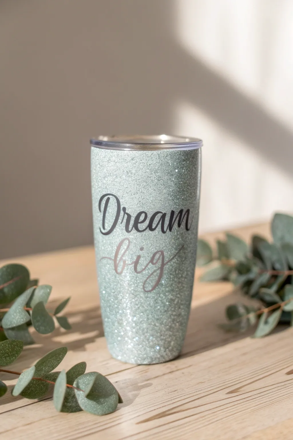Sip in style and motivation with this 'Dream Big' glitter tumbler.