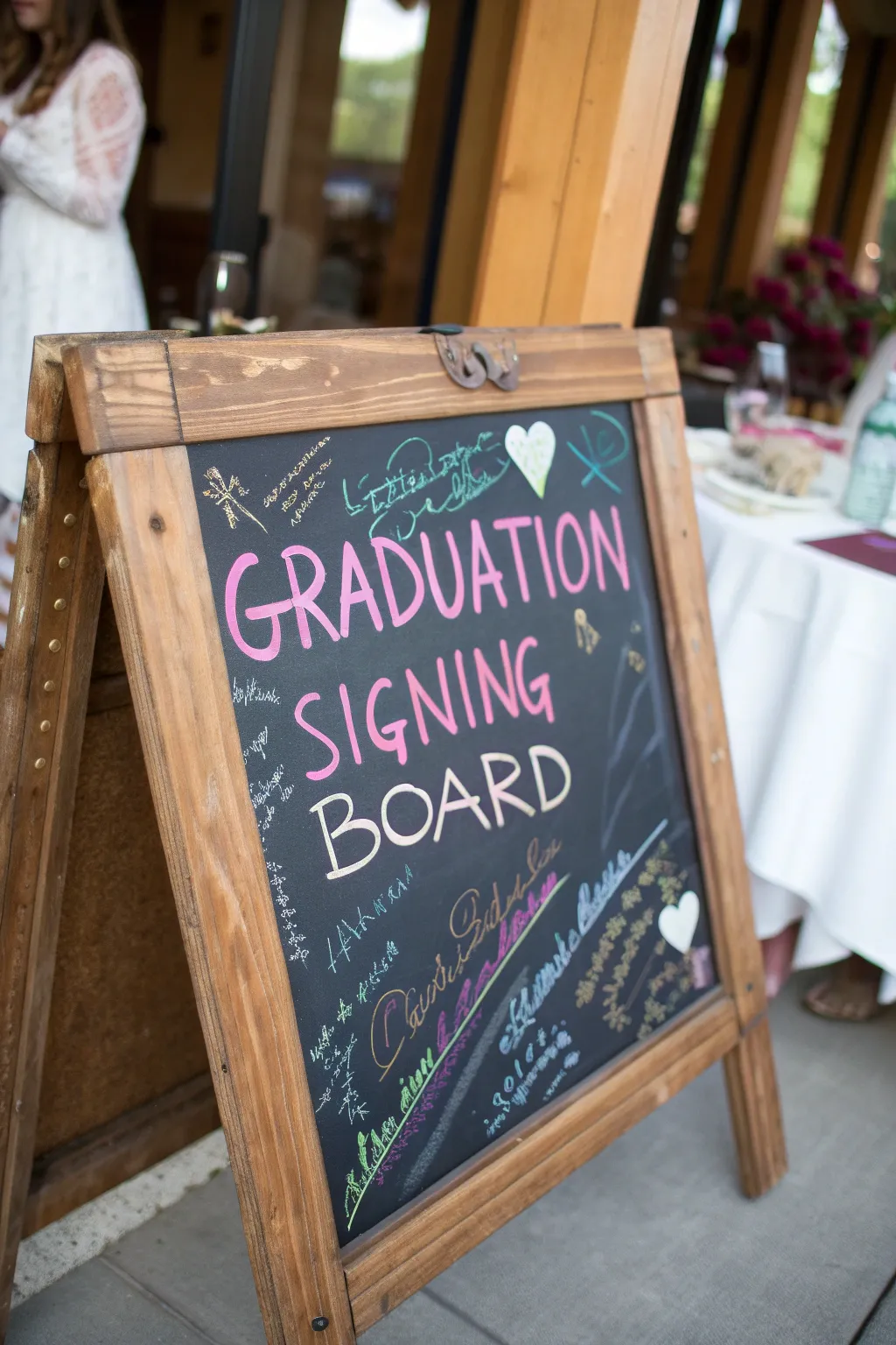 A whimsical chalkboard signing board full of charm.