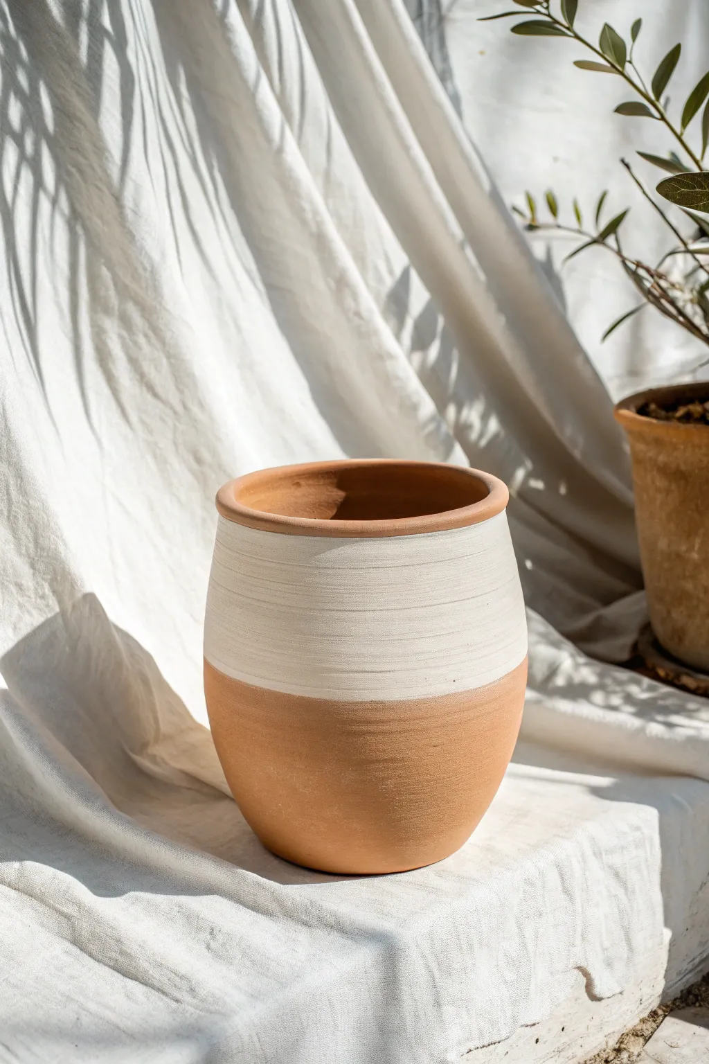 Embrace the calming allure of minimalist earth tones with this beautifully crafted ceramic pot.