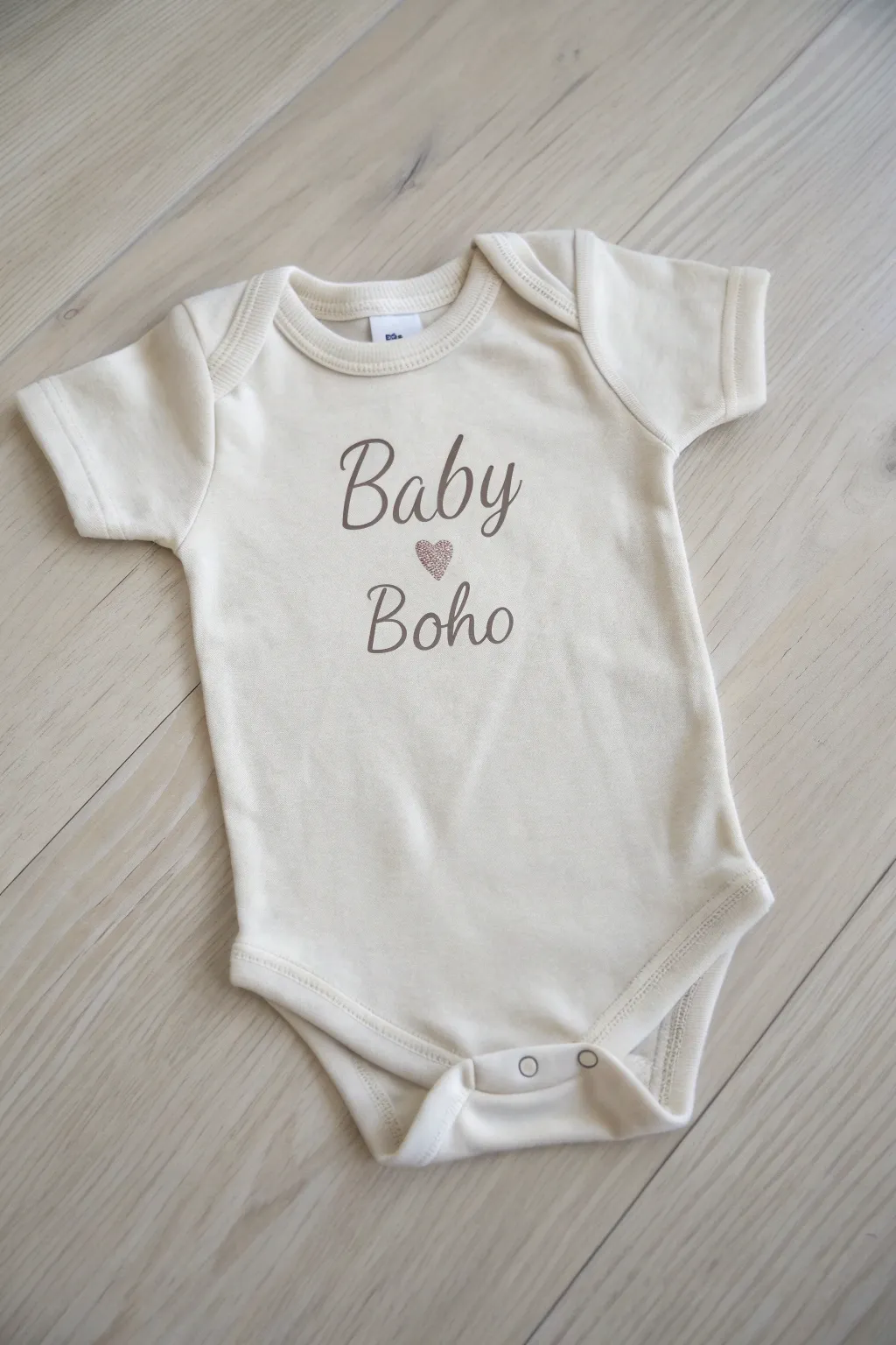 Celebrate the joy of new life with a personalized touch: a handcrafted onesie that becomes a cherished keepsake.