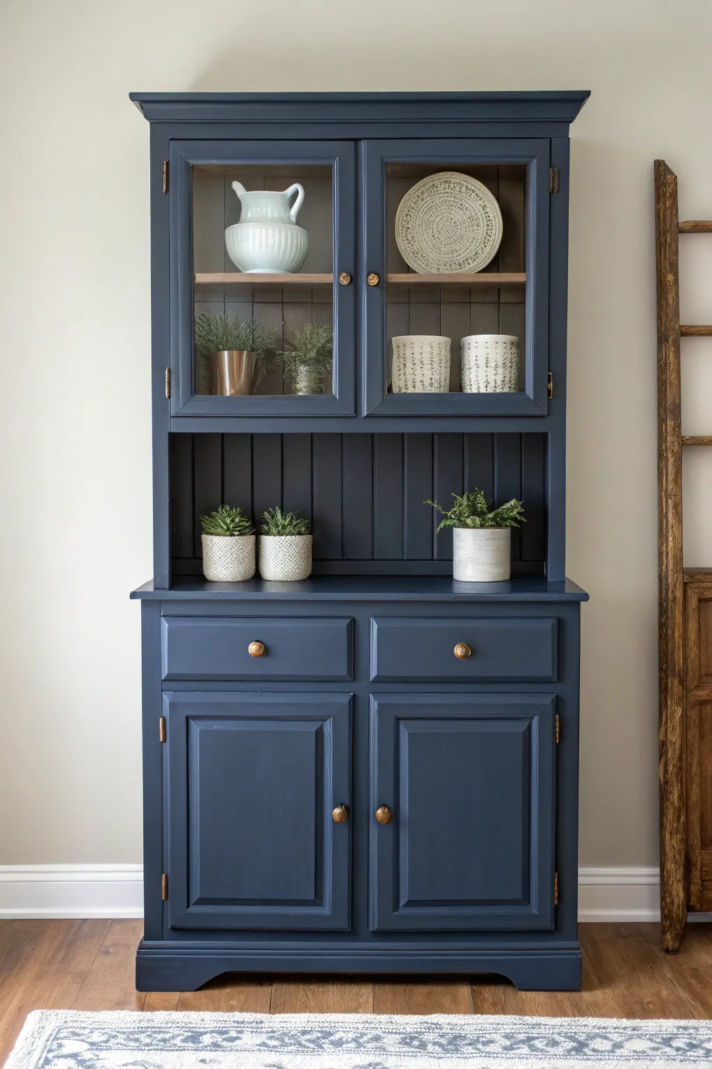 Transform your space with navy elegance: a stunning hutch makeover.