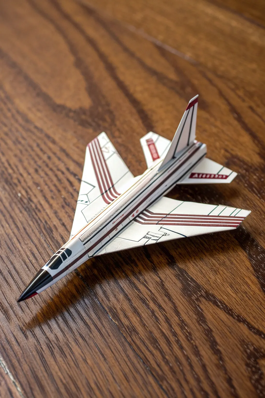 Unleash your inner pilot with this jet-inspired paper airplane, crafted for speed and style.