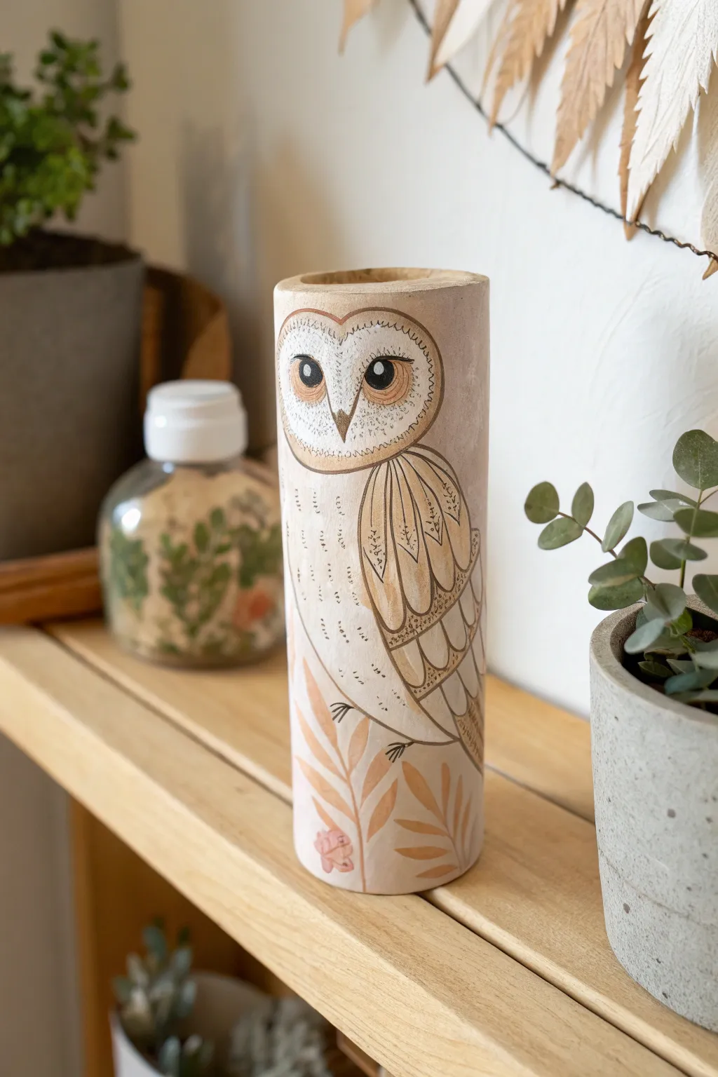 Transform everyday items into charming art! This recycled cardboard tube owl adds a cozy, eco-friendly touch to any space.