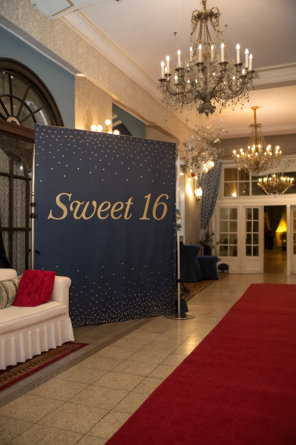 A personalized 'Sweet 16' backdrop offers a unique photo opportunity for guests.
