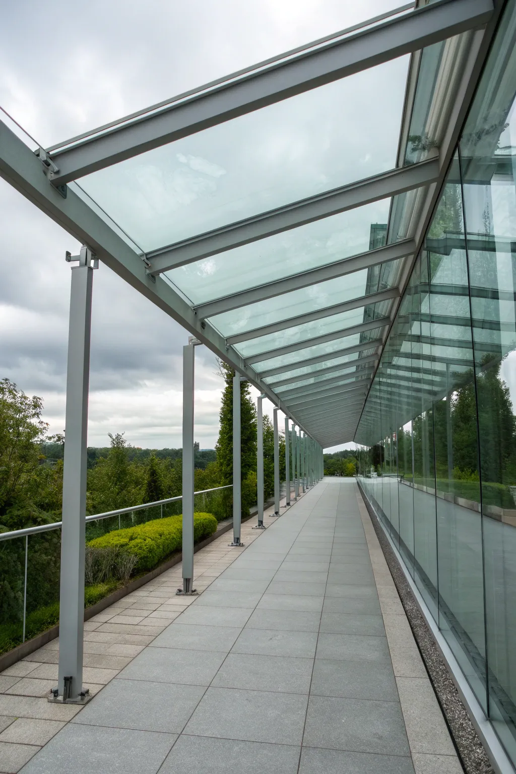 Step into modern elegance with a glass canopy that seamlessly blends light and design.