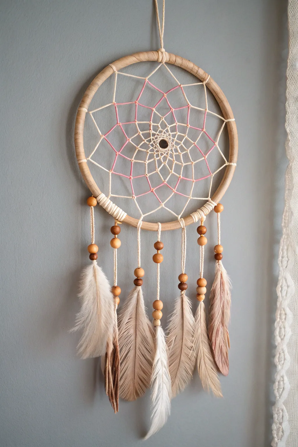 Embrace serenity with a handcrafted dream catcher, an exquisite blend of simplicity and bohemian charm.