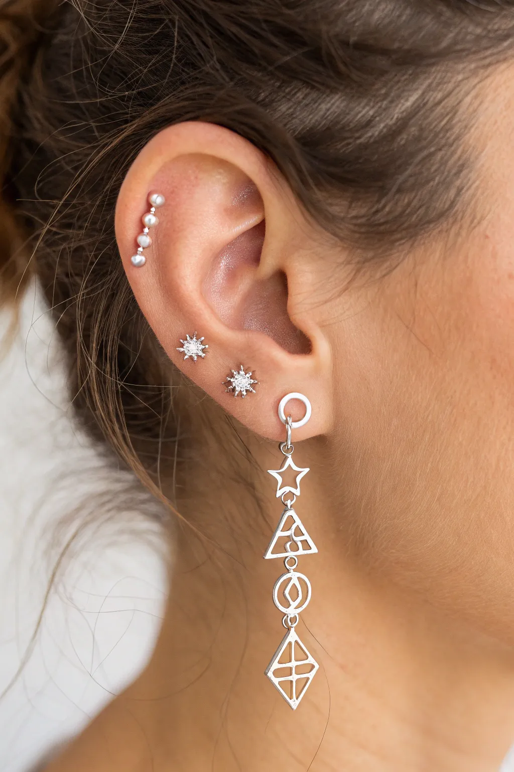 Chic and minimal: Create your own ear constellation with stacked studs.