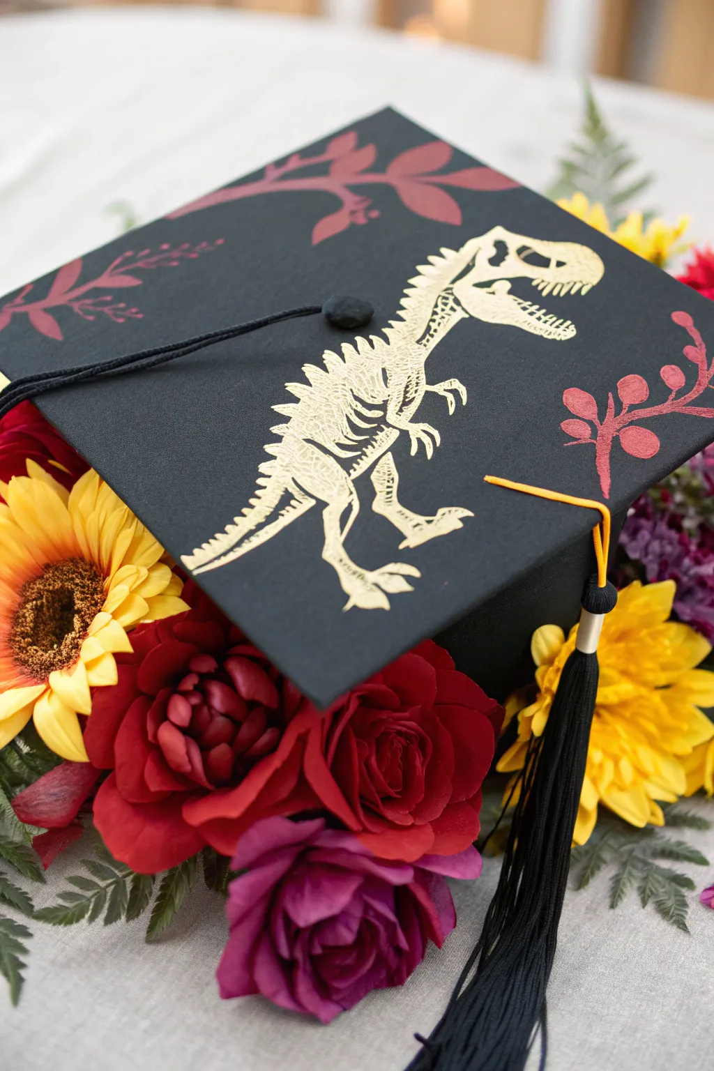 Elevate your graduation style with a bold fusion of prehistoric and floral artistry!