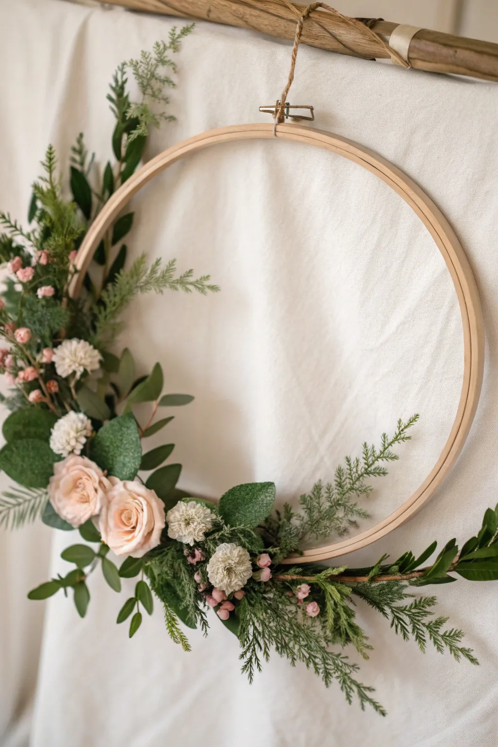 Elevate your spring decor with this chic and modern hoop art wreath, blending minimalism with natural elegance.