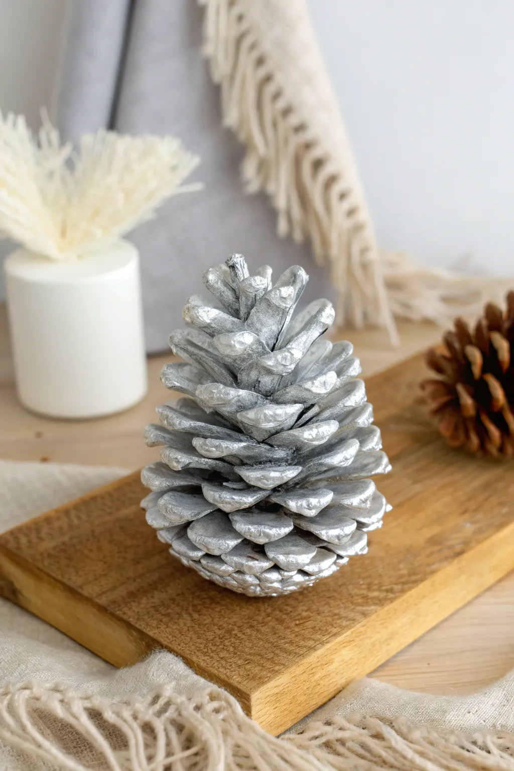 Transform your space into a serene winter wonderland with frosted pine cone elegance.