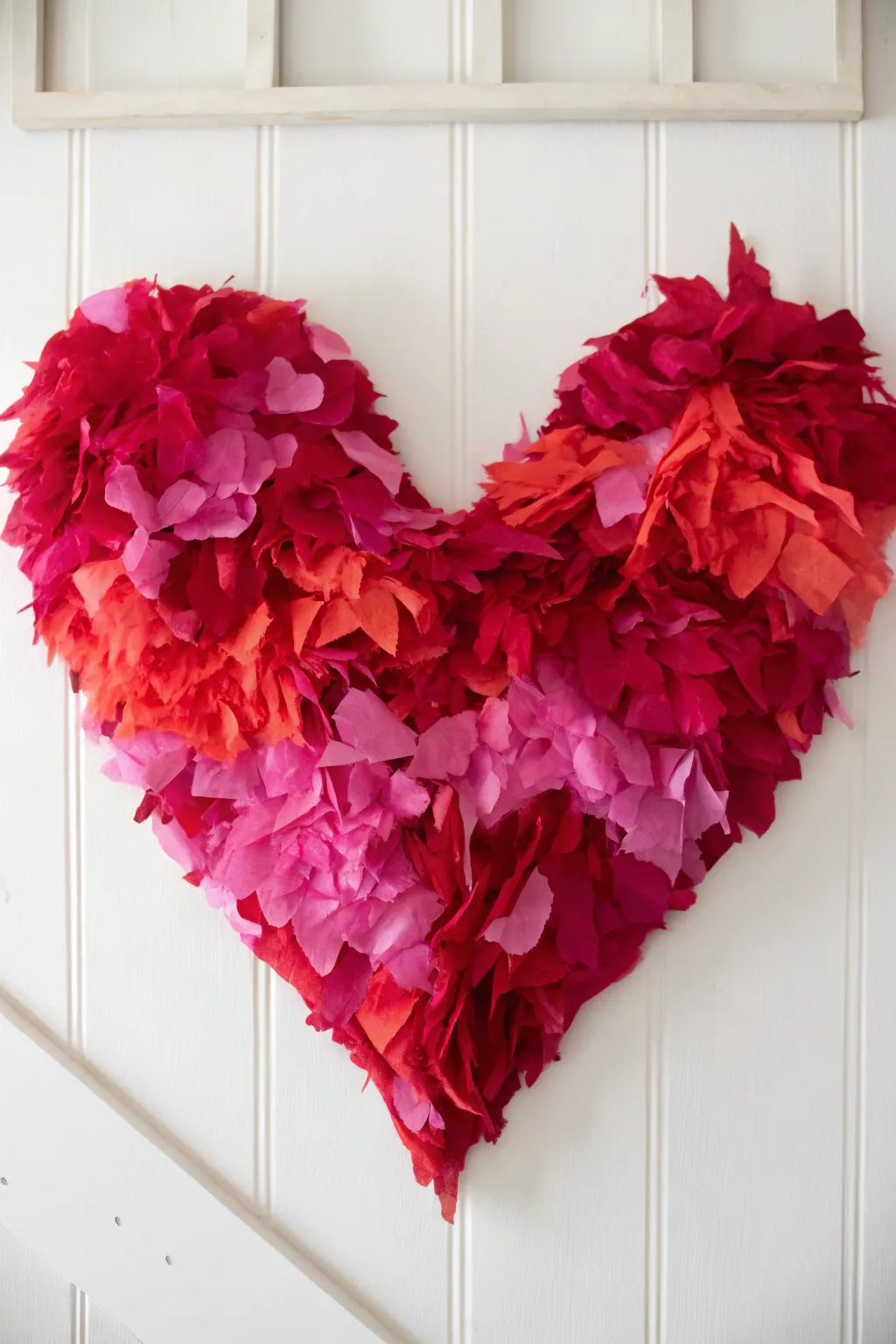 Celebrate creativity with this vibrant tissue paper heart collage, a perfect blend of bold colors and minimalist design for a charming Valentine's craft.