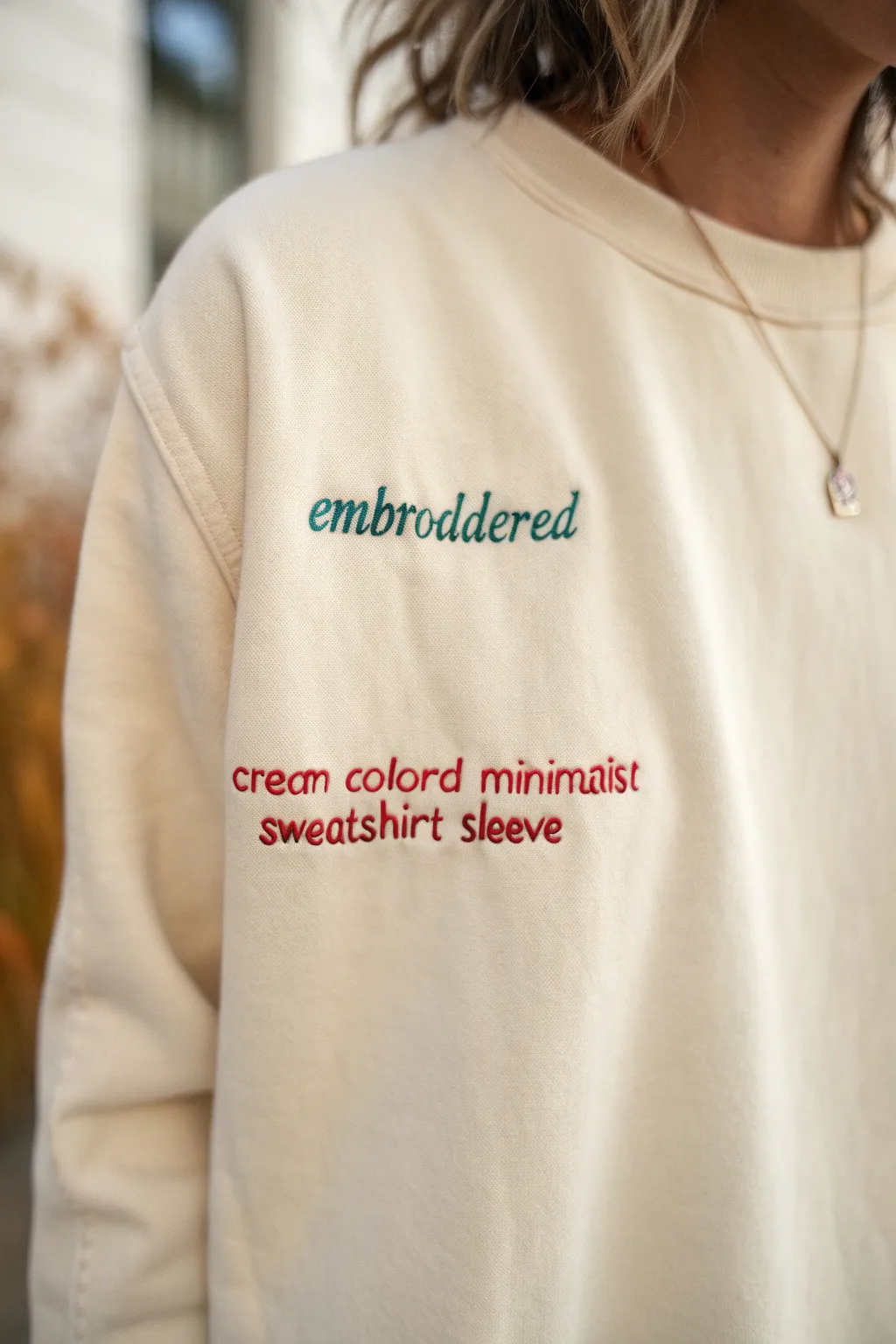 Wrap yourself in words of wisdom with this beautifully embroidered sweatshirt sleeve, a perfect blend of simplicity and bold inspiration.