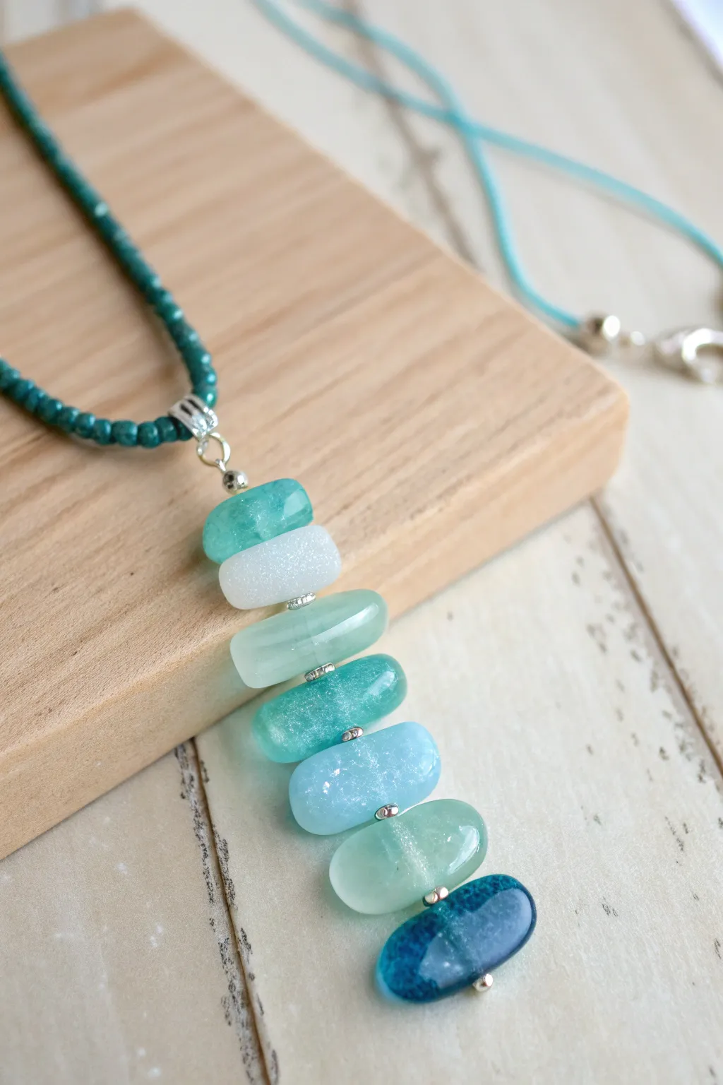 Dive into elegance with layered transparency necklaces, where oceanic hues meet minimalist design.