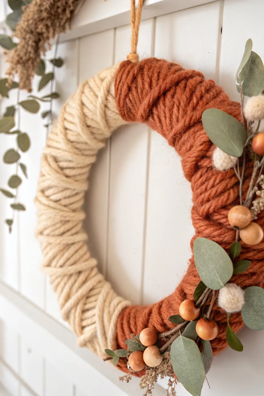 Embrace cozy elegance with a handcrafted yarn wreath that blends Scandinavian minimalism with boho warmth.